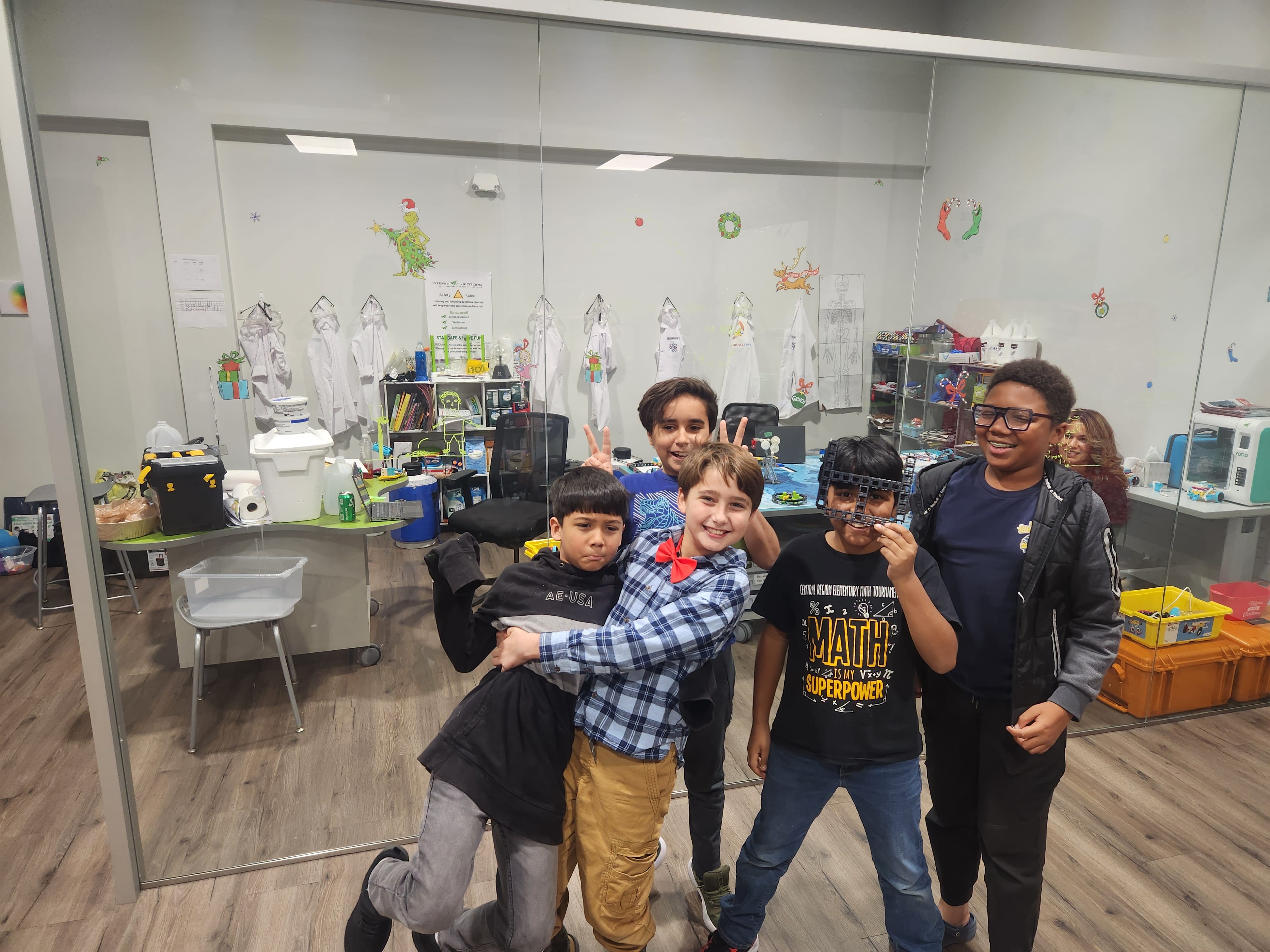 STEAM Inventors FLL team with trophy